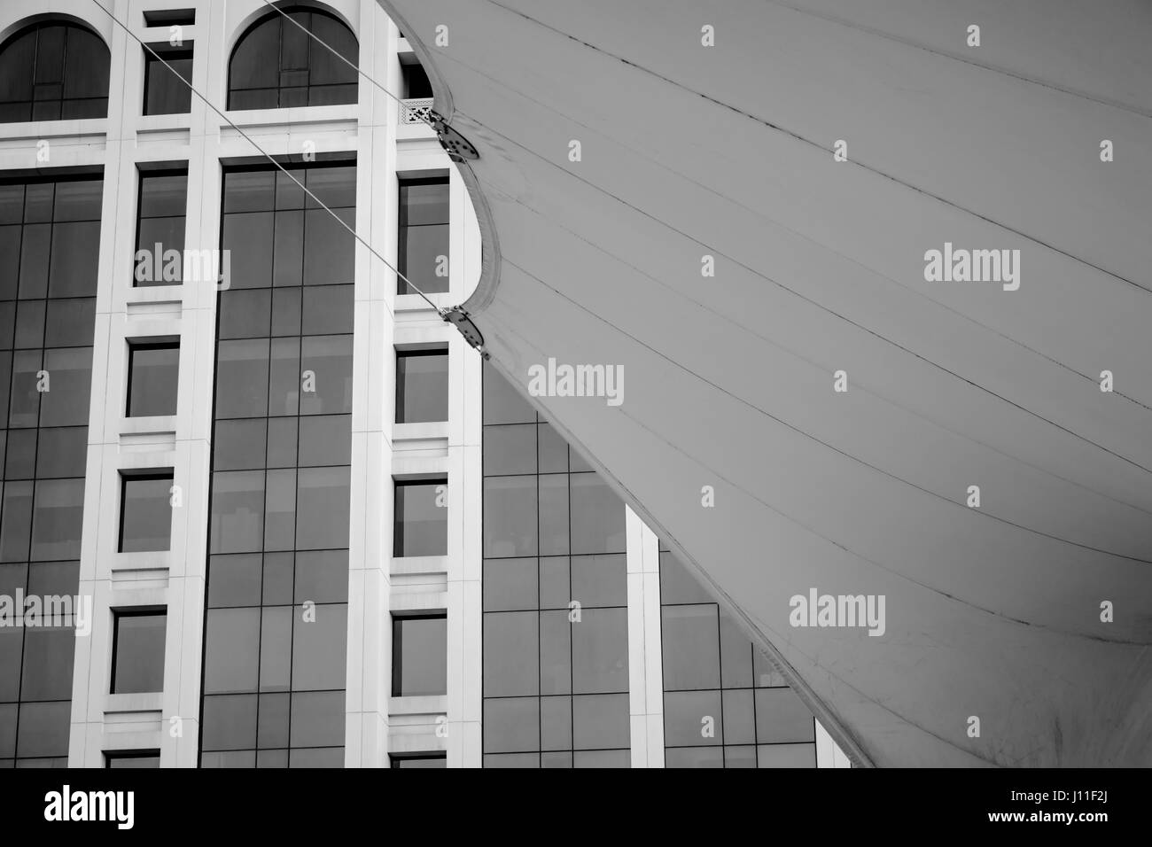 Low Angle View of Modern Building Facade and Street Shadow Maker Stock Photo
