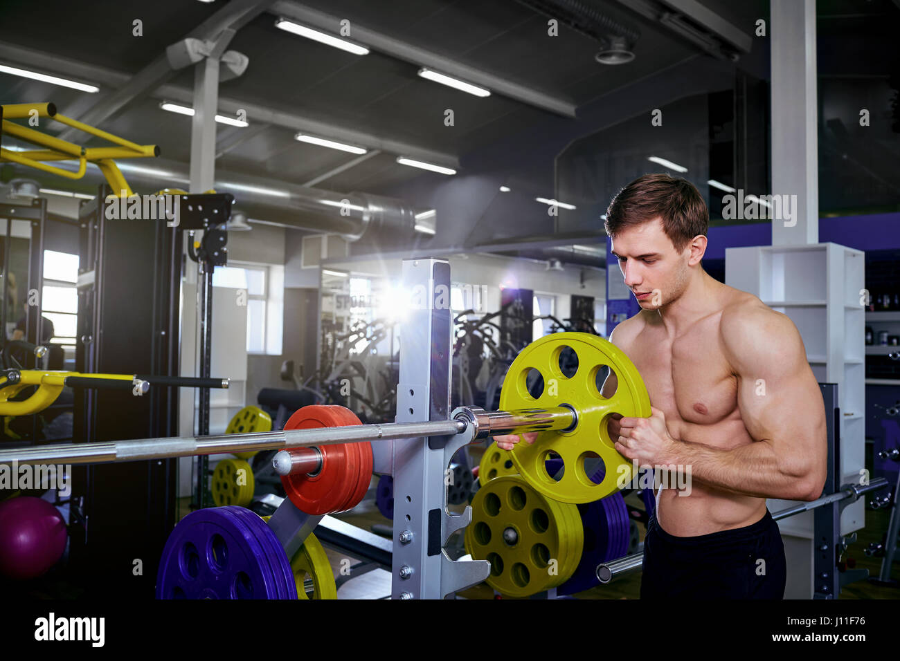 Exercise a barbell hires stock photography and images Alamy
