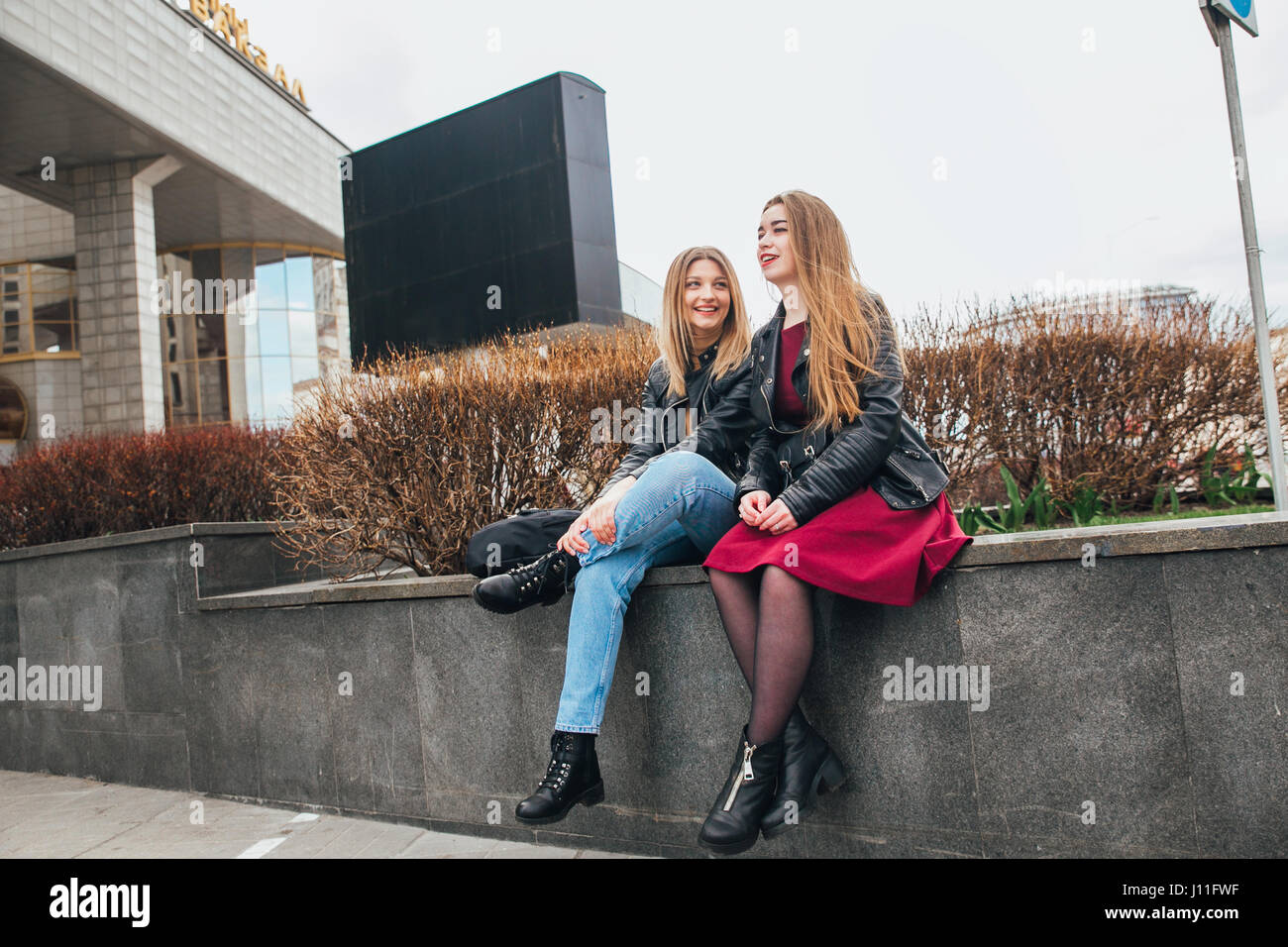 Friendship . Two Women Talking in the City Stock Photo