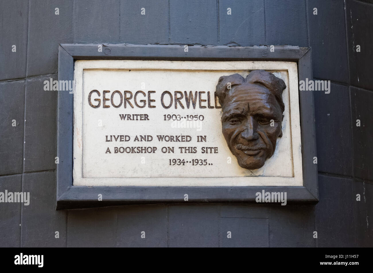 The face of George Orwell on a plaque on Booklovers Corner, South End Green in Hampstead, London England United Kingdom UK Stock Photo