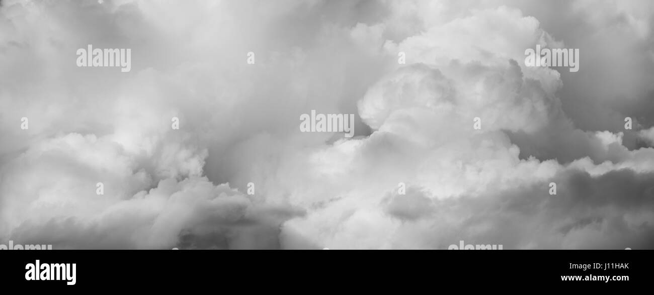 Grey fluffy clouds in sky Stock Photo