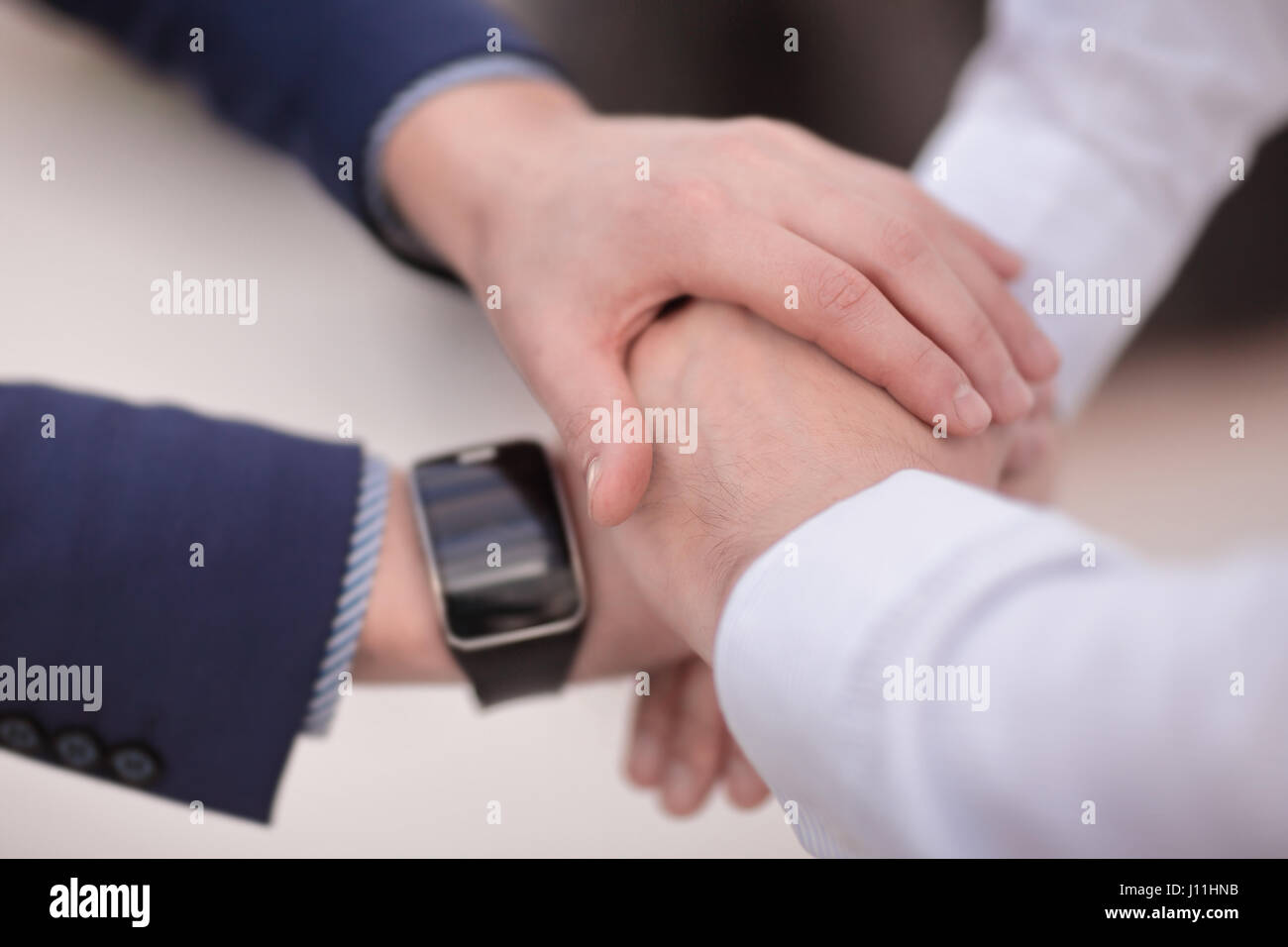 Business group with hands together - Stock Photo