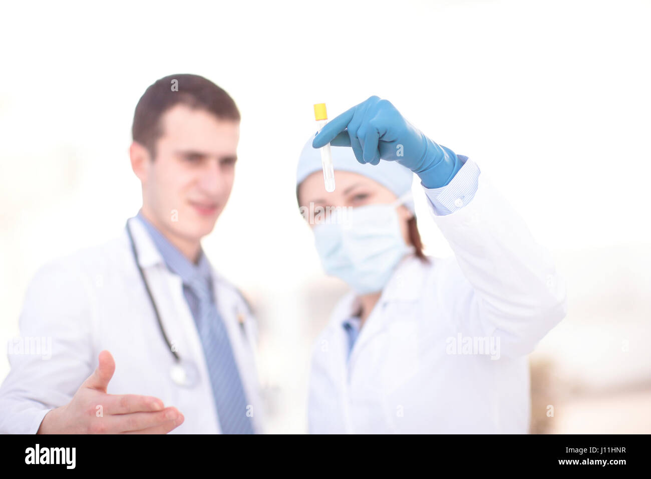 Doctors examining a blood sample in a laboratory Stock Photo