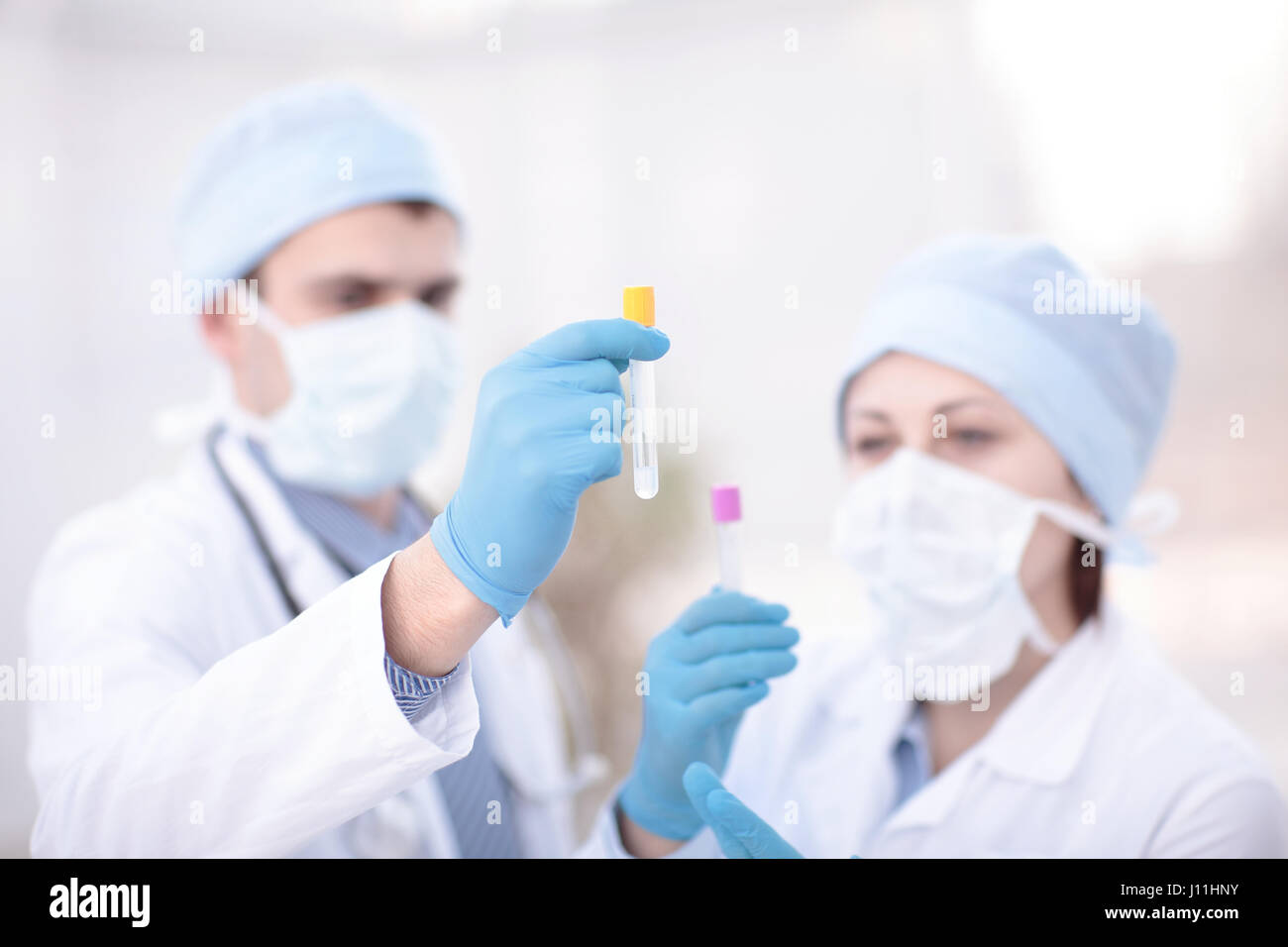 Doctors examining a blood sample in a laboratory Stock Photo