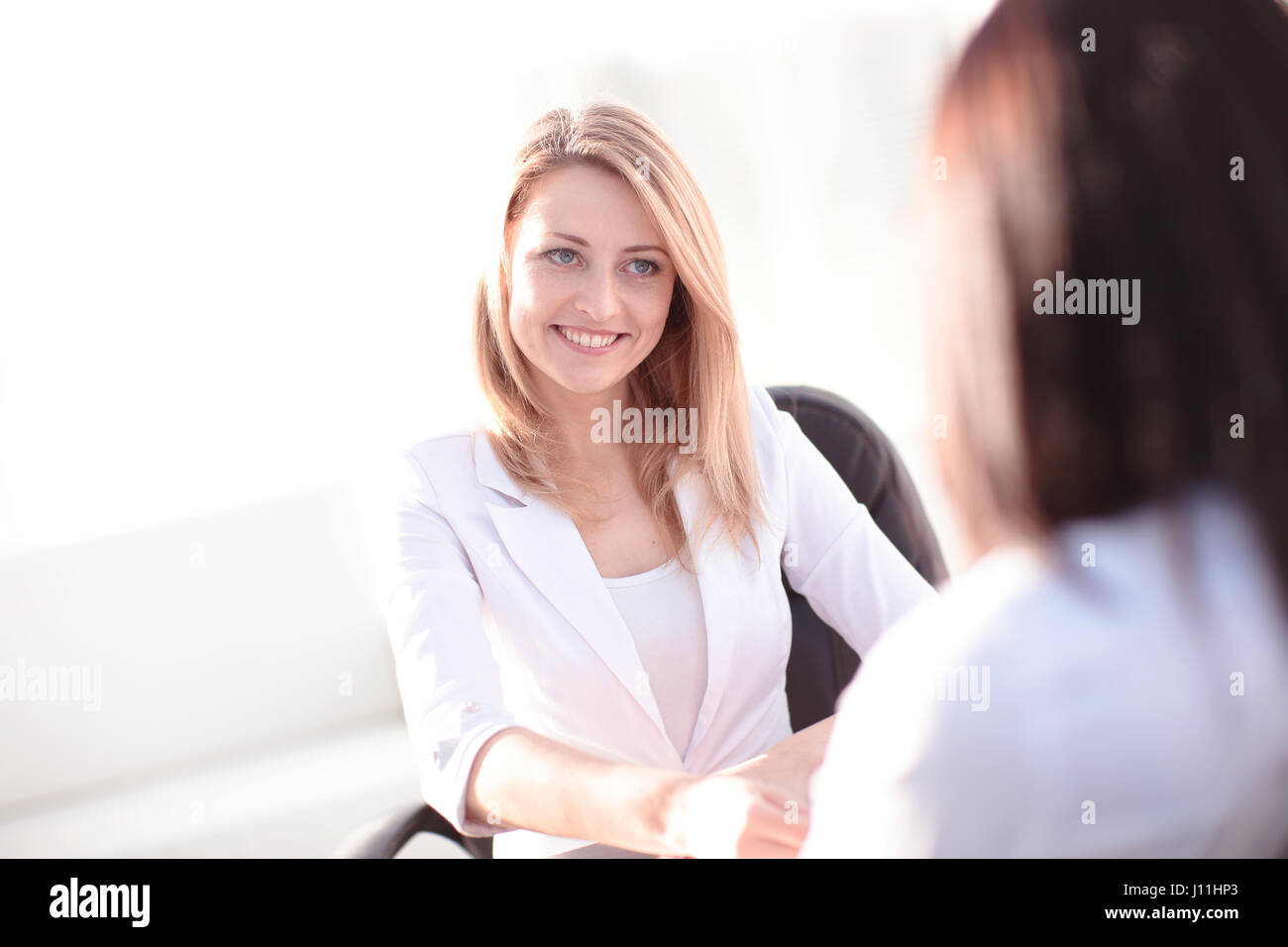Two Businesswomen Meeting In Office Stock Photo - Alamy