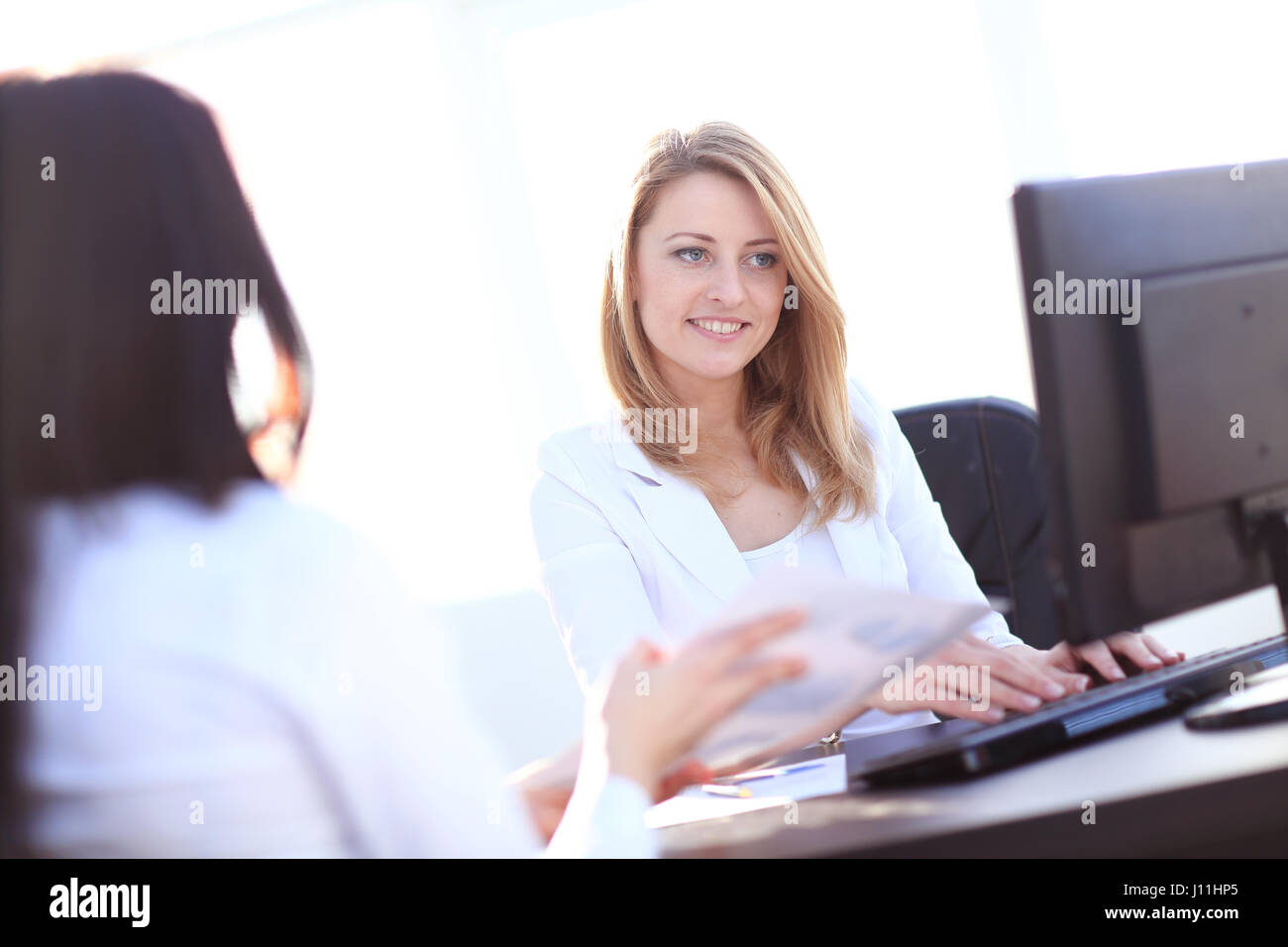 Two Businesswomen Meeting In Office Stock Photo