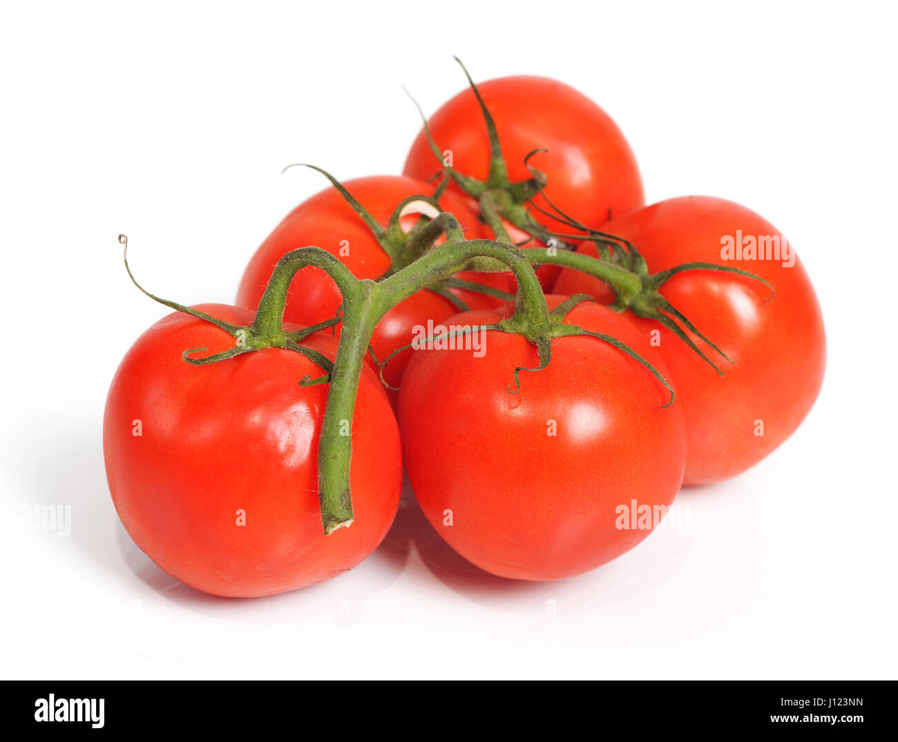 Bunch of red tomatoes isolated on white background Stock Photo - Alamy