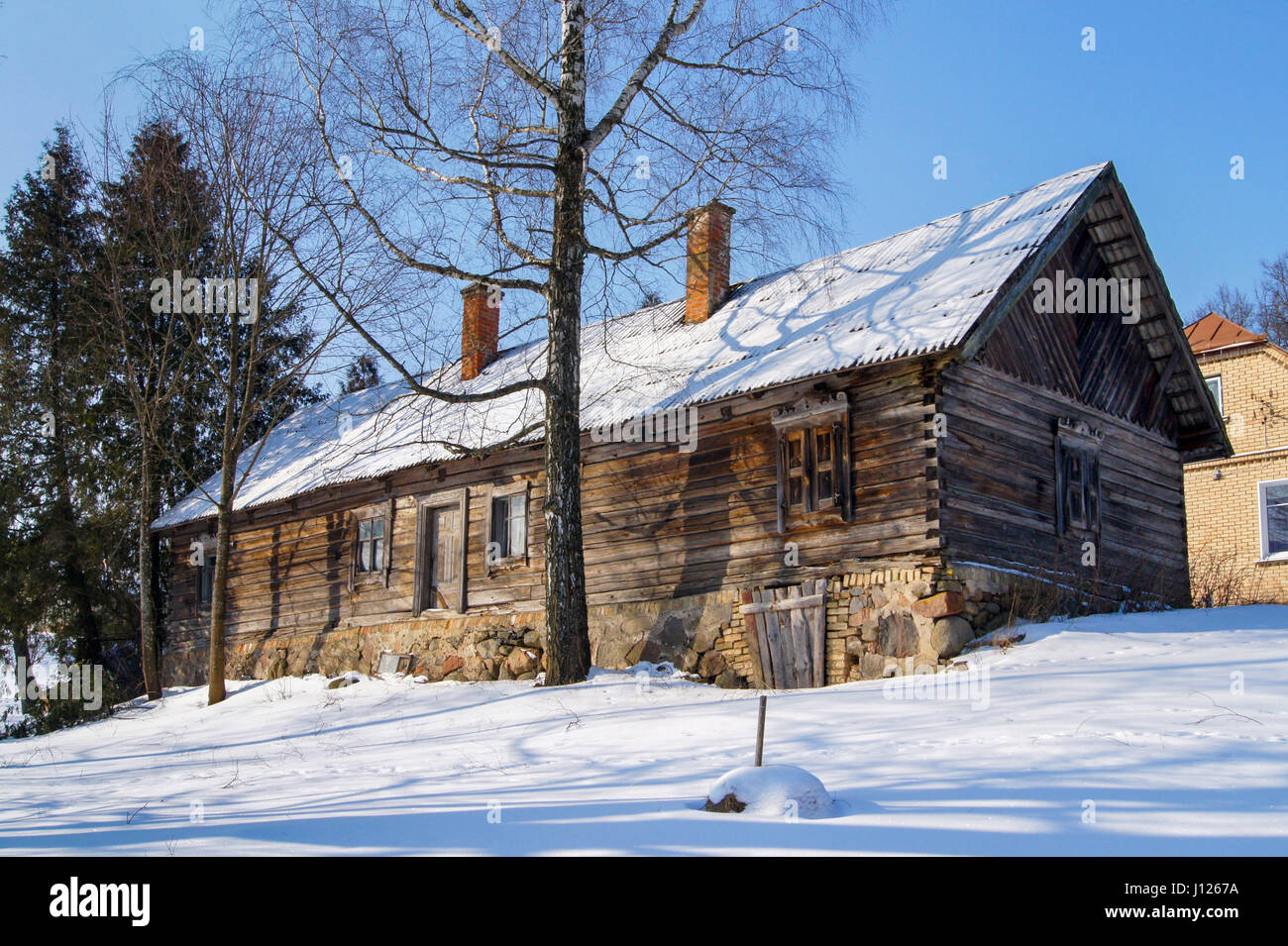 Wooden house in a nature area covered with freshly fallen snow Stock ...
