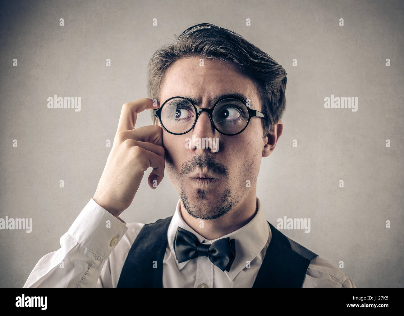 Portrait of confused man Stock Photo - Alamy
