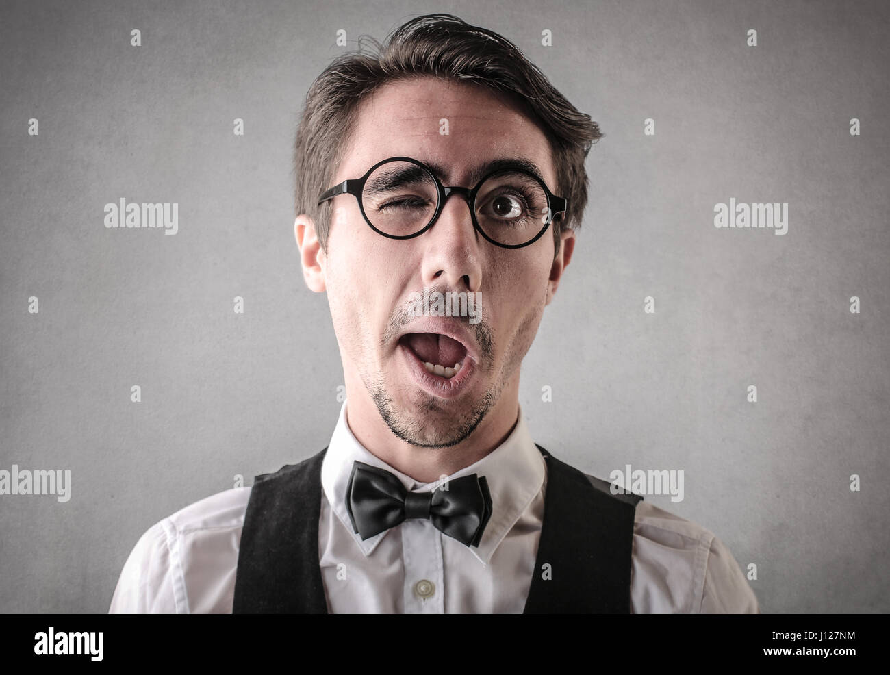 Portrait of winking elegant man Stock Photo