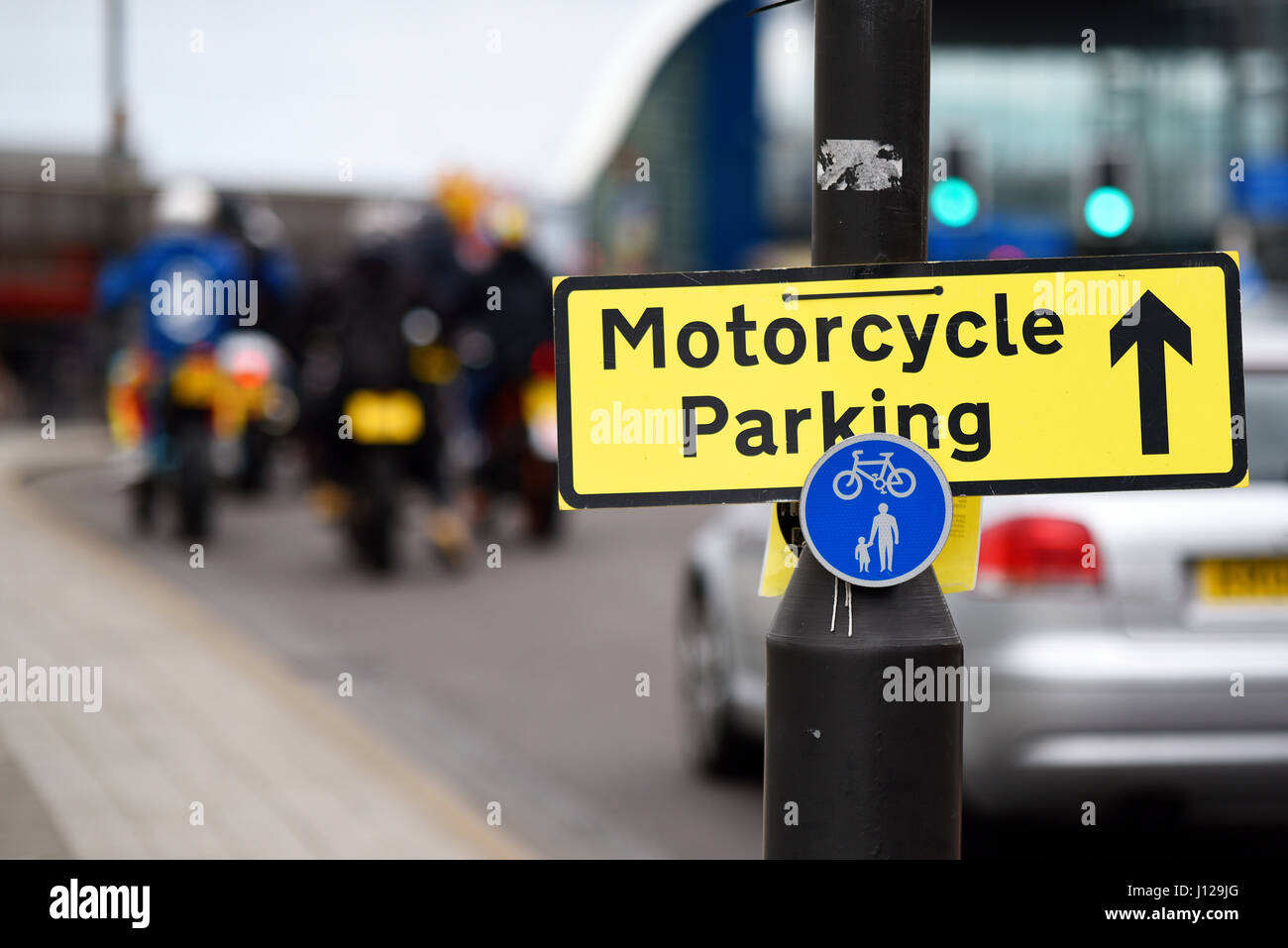 Motorcycle Parking sign during the Southend Shakedown, a large motorbike rally to the seaside town. Temporary event sign, with bikers and copyspace Stock Photo