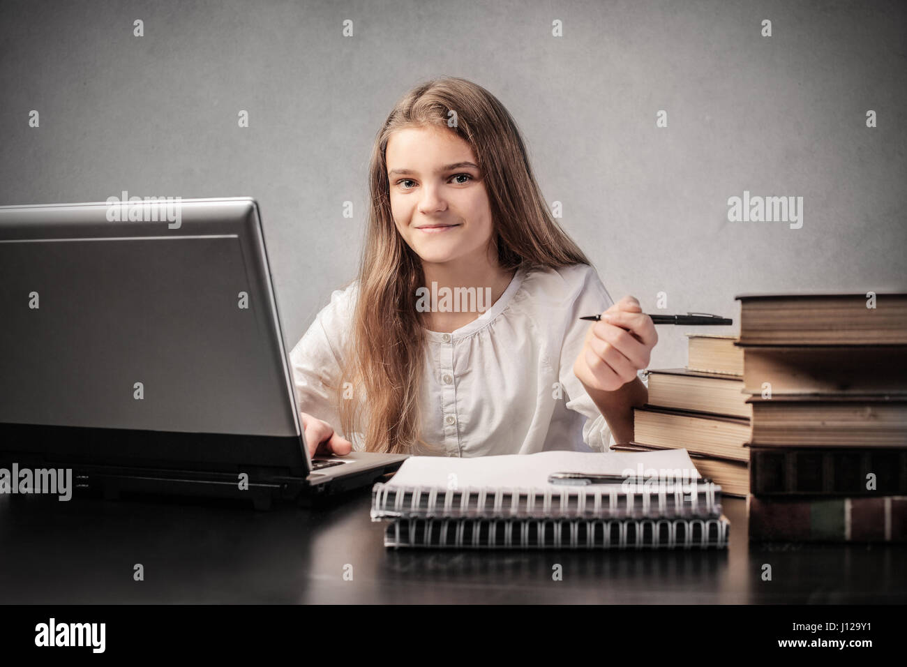 Young student girl with books Stock Photo - Alamy
