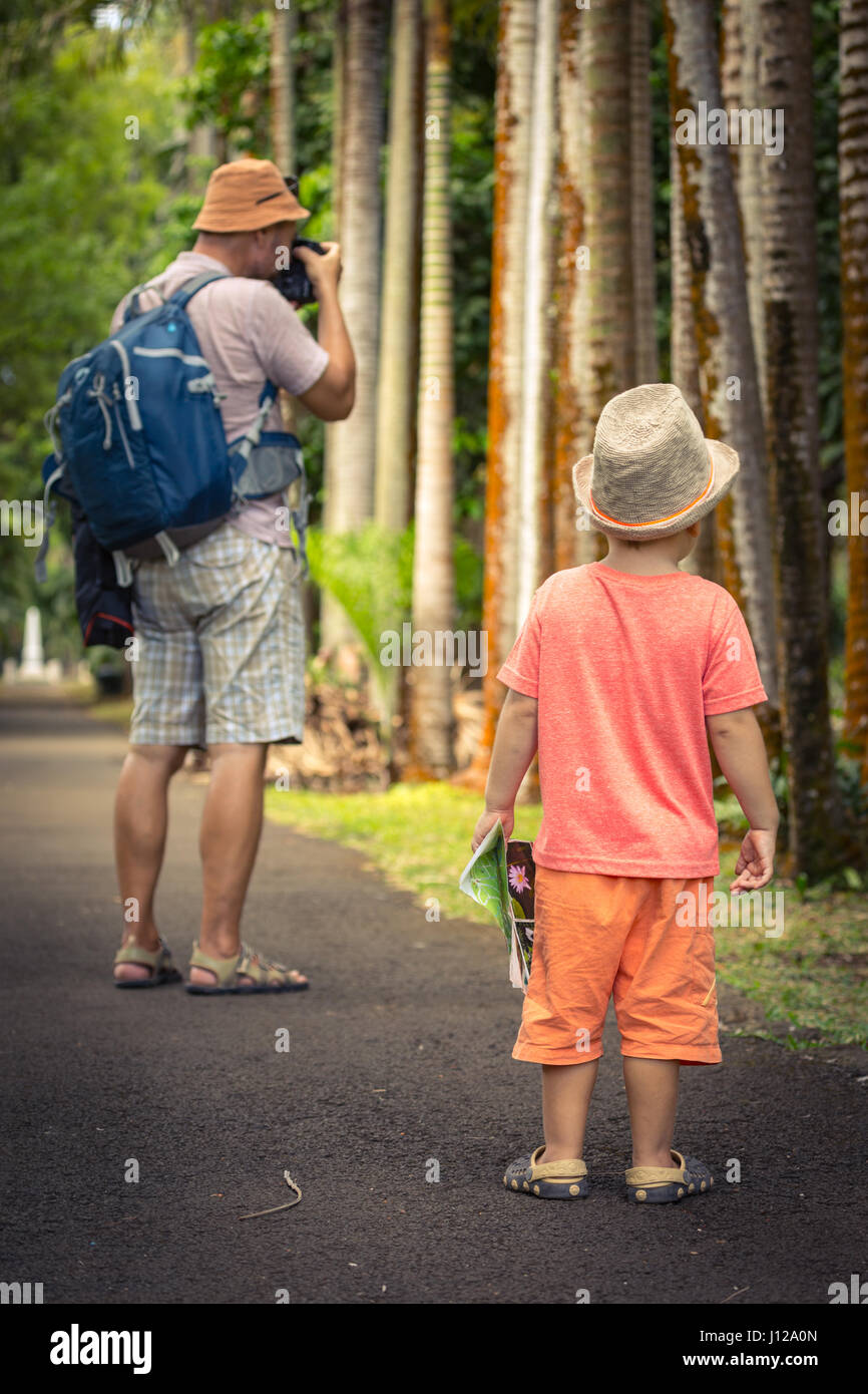 Father and son at botanical garden. Mauritius Stock Photo