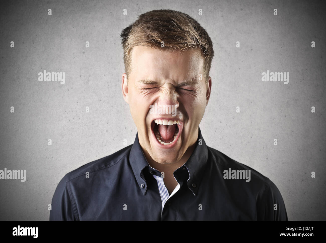 Young man screaming Stock Photo