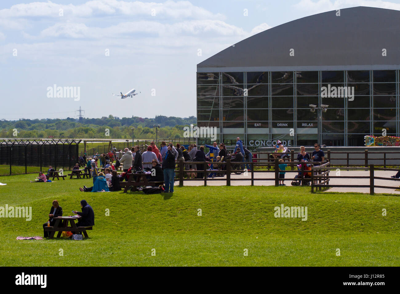 Planespotters watching aircraft at Manchester Airport Aviation Viewing Park Stock Photo