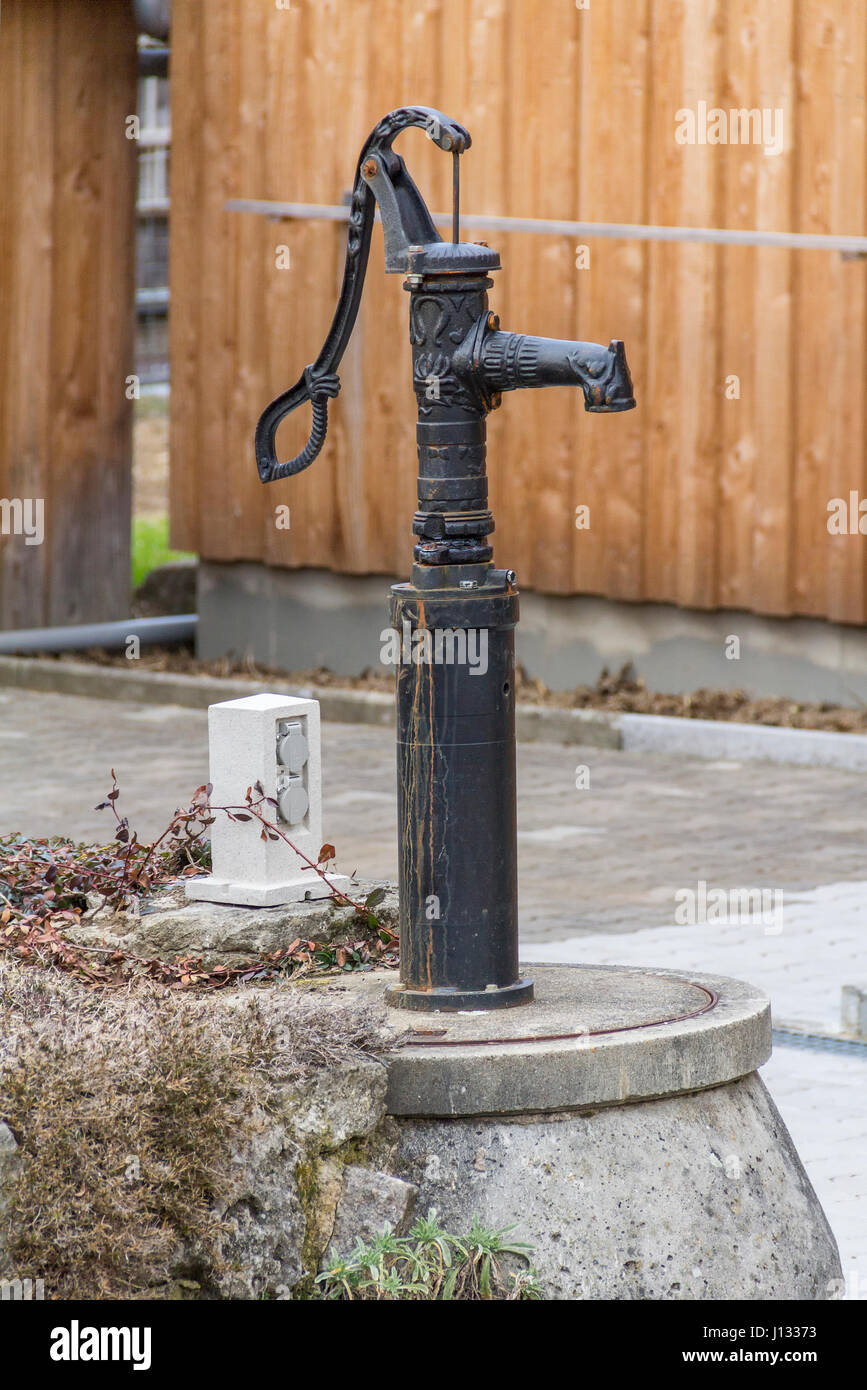 rural scenery including a nostalgic water pump Stock Photo