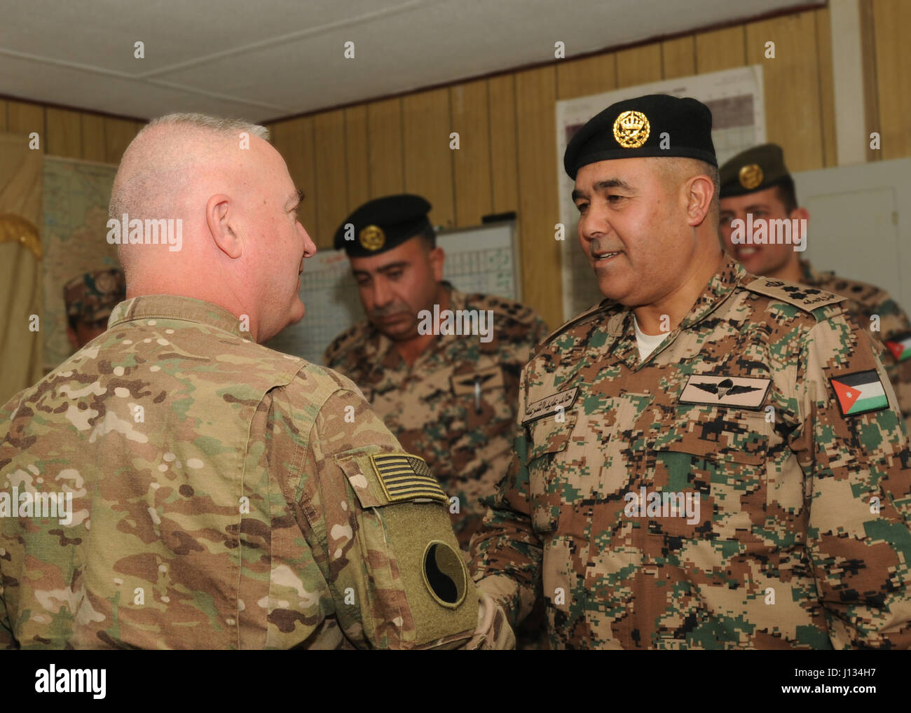 Jordanian Brig. Gen. Khalid Al-Shara, training deputy director for Jordan Armed Forces – Arab Army, greets Maj. Gen. Blake C. Ortner, commanding general for the 29th Infantry Division, during Ortner's visit to Jordan Feb. 6, 2017. The two leaders discussed the positive results of conducting joint training with American and Jordanian soldiers. (U.S. Army National Guard photo by Sgt. Kelly Gary, 29th Infantry Division Public Affairs) Stock Photo
