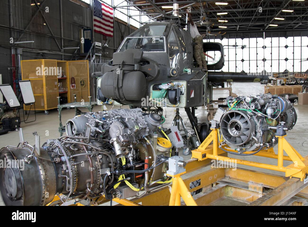 The engines of an AH-64 Apache helicopter await to be hoisted and Stock