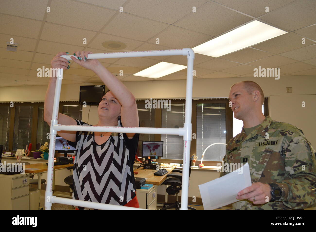 Army Capt. Matthew Baumann, registered occupational therapist, watches