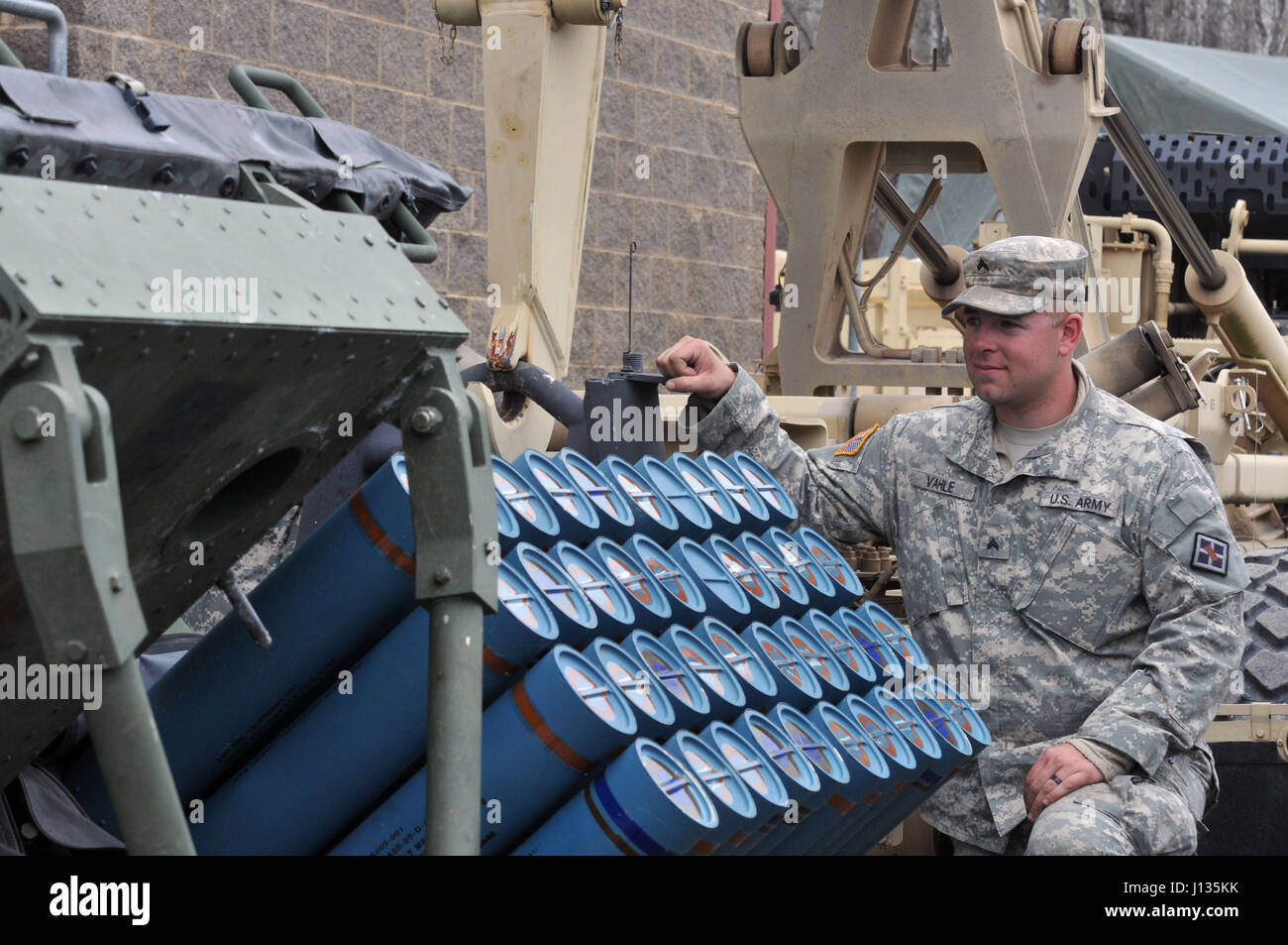 U.S. Army Reserve Cpl. Nicholas Vahle with the 979th Mobility Augmentation Company, 478th Engineer Battalion, 926th Engineer Brigade, 412th Theater Engineer Command, based in Lexington, Ky., pauses to look at 40 training mine canisters in one panel of a M136 Volcano weapons system during the company's training at Wilcox Range on Fort Knox, Ky.,April 1, 2017. This was part of Engineer Qualification Table XII. This company was the first U.S. Army Reserve unit to accomplish this feat. (U.S. Army Reserve Photo by Sgt. 1st Class Clinton Wood) Stock Photo