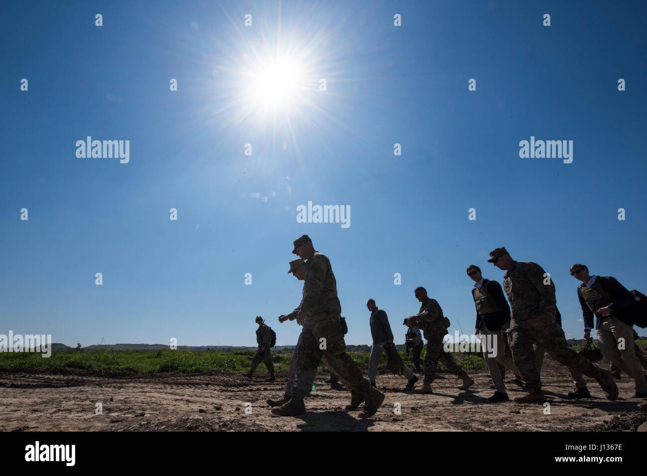 Marine Corps Gen. Joseph F. Dunford Jr., chairman of the Joint Chiefs of Staff, Jared Kushner, Senior Advisor to President Donald J. Trump,Tom Bossert, the president’s homeland security advisor, and Douglas A. Silliman, U.S. Ambassador to the Republic of Iraq, and Lt. Gen. Stephen J. Townsend, commander, Combined Joint Task Force – Operation Inherent Resolve, meet with Service Members at a forward operating base near Qayyarah West in Iraq, April 4, 2017. DoD Photo by Navy Petty Officer 2nd Class Dominique A. Pineiro Stock Photo