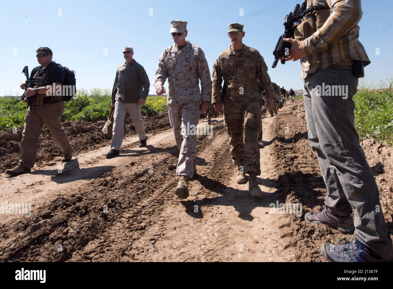 Marine Corps Gen. Joseph F. Dunford Jr., chairman of the Joint Chiefs of Staff, Jared Kushner, Senior Advisor to President Donald J. Trump,Tom Bossert, the president’s homeland security advisor, and Douglas A. Silliman, U.S. Ambassador to the Republic of Iraq, and Lt. Gen. Stephen J. Townsend, commander, Combined Joint Task Force – Operation Inherent Resolve, meet with Service Members at a forward operating base near Qayyarah West in Iraq, April 4, 2017. DoD Photo by Navy Petty Officer 2nd Class Dominique A. Pineiro Stock Photo