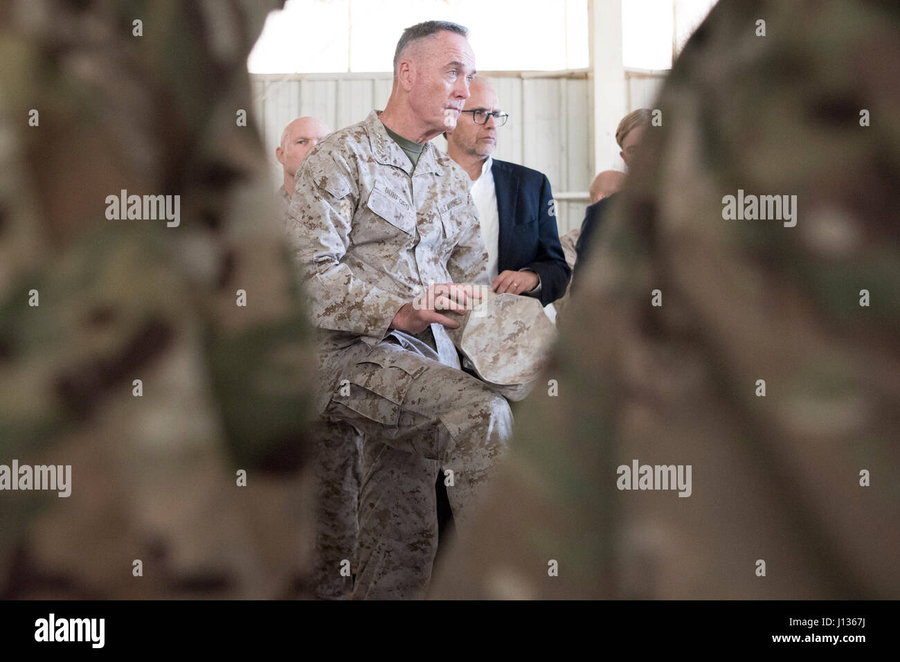 Marine Corps Gen. Joseph F. Dunford Jr., chairman of the Joint Chiefs of Staff, Jared Kushner, Senior Advisor to President Donald J. Trump,Tom Bossert, the president’s homeland security advisor, and Douglas A. Silliman, U.S. Ambassador to the Republic of Iraq, and Lt. Gen. Stephen J. Townsend, commander, Combined Joint Task Force – Operation Inherent Resolve, meet with Service Members at a forward operating base near Qayyarah West in Iraq, April 4, 2017. DoD Photo by Navy Petty Officer 2nd Class Dominique A. Pineiro Stock Photo