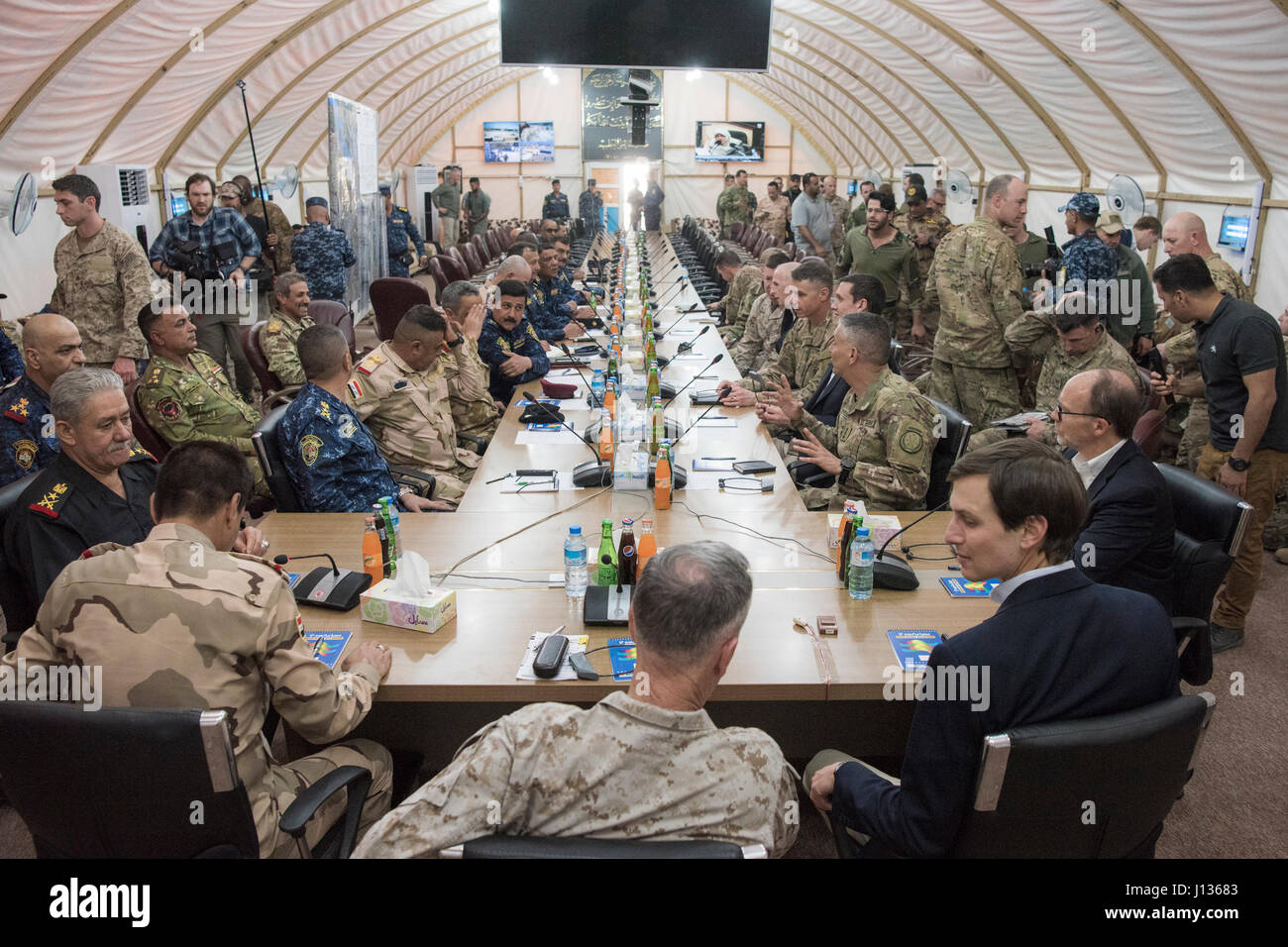 Marine Corps Gen. Joseph F. Dunford Jr., chairman of the Joint Chiefs of Staff, Jared Kushner, Senior Advisor to President Donald J. Trump,Tom Bossert, the president’s homeland security advisor, and Douglas A. Silliman, U.S. Ambassador to the Republic of Iraq, and Lt. Gen. Stephen J. Townsend, commander, Combined Joint Task Force – Operation Inherent Resolve, meet with Iraqi Security Forces at a forward operating base near Qayyarah West in Iraq, April 4, 2017. DoD Photo by Navy Petty Officer 2nd Class Dominique A. Pineiro Stock Photo