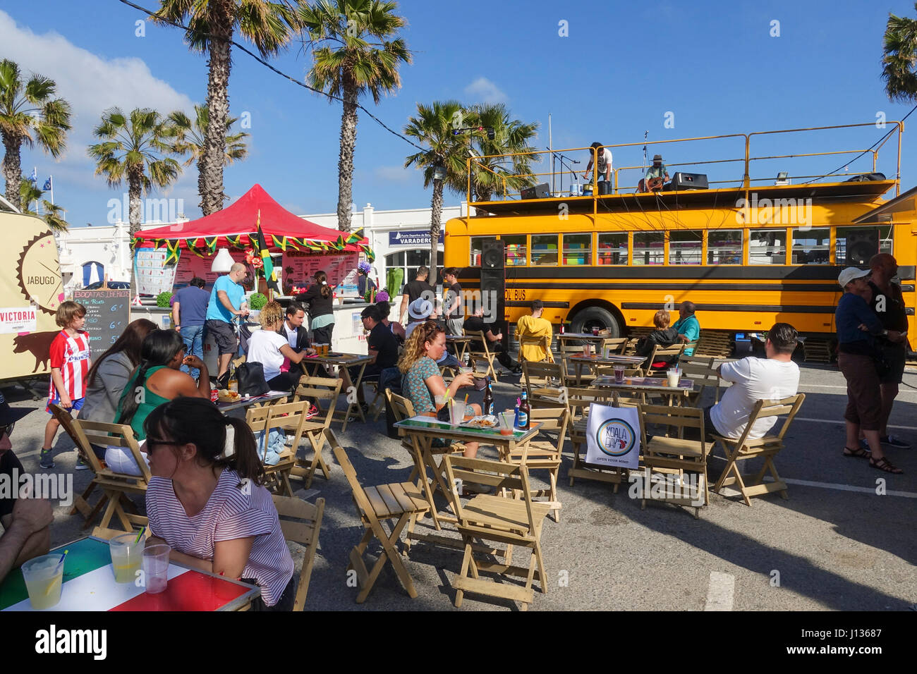 People at terrace on Food trucks festival, festive, celebration in Port of Benalmadena, Andalusia, Spain Stock Photo