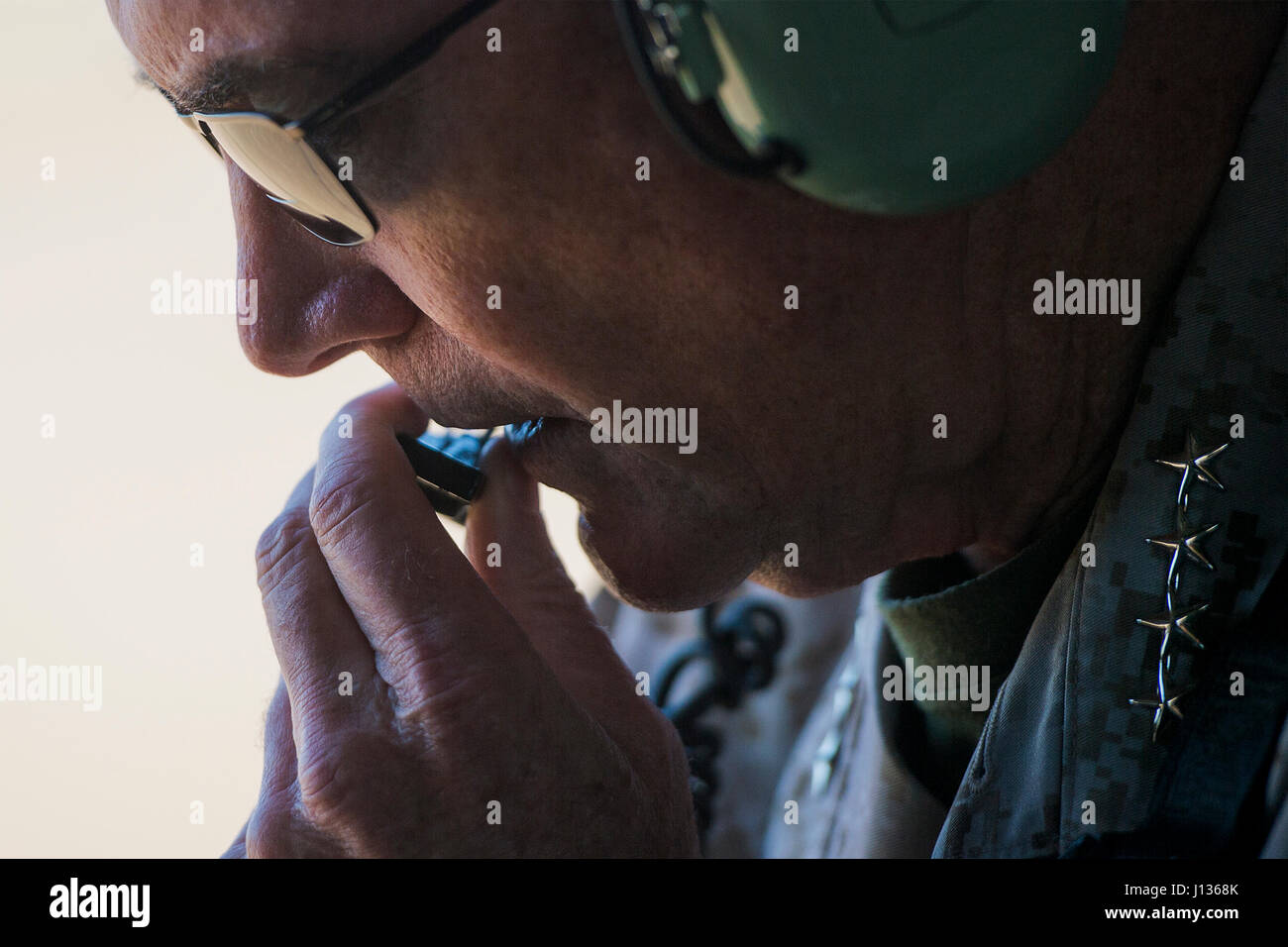 Marine Corps Gen. Joseph F. Dunford Jr., chairman of the Joint Chiefs of Staff, transits to Qayyarah West in Iraq via helicopter movement, April 4, 2017. DoD Photo by Navy Petty Officer 2nd Class Dominique A. Pineiro Stock Photo