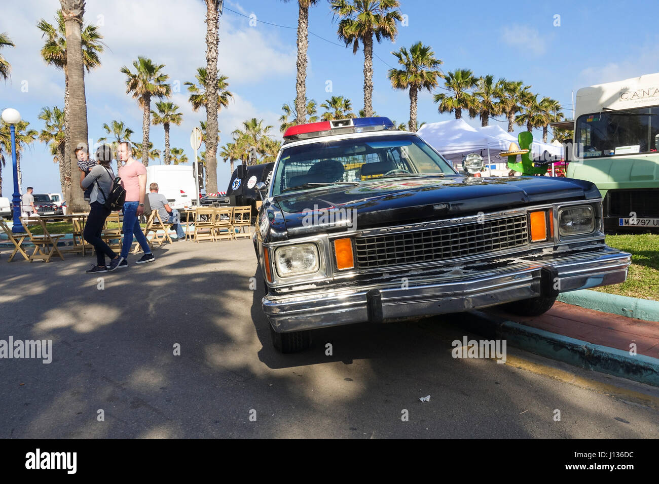 American police car Food trucks festival, festive, celebration in Port of Benalmadena, Andalusia, Spain Stock Photo
