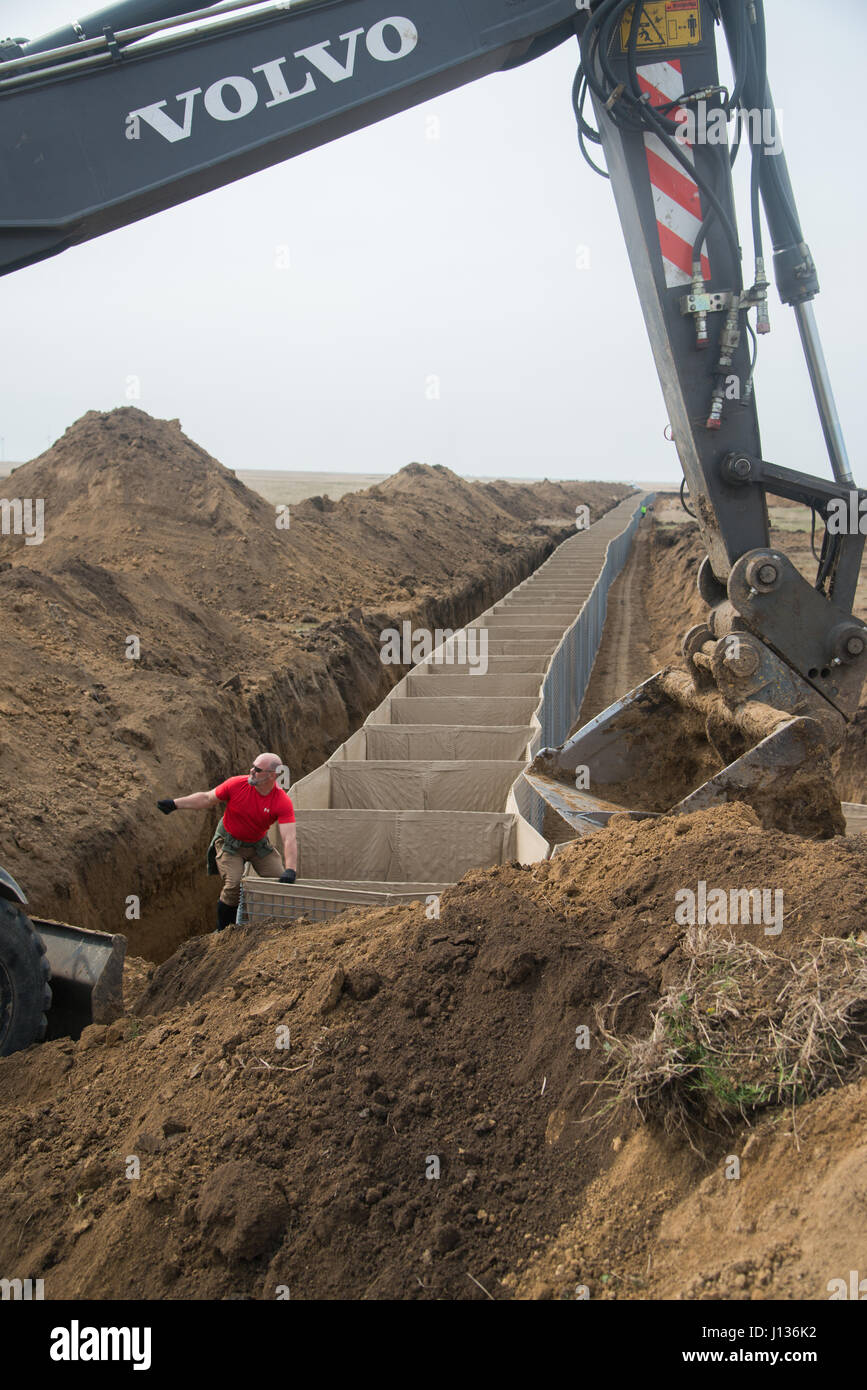 HESCO barriers are being installed in Smardan, Romania, to protect the ...