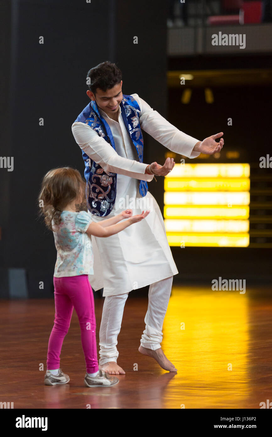 Seattle, Washington: Museum of History & Industry. Dancer from Culture Shakti with a young visitor in the Grand Atrium during Family Day with Festál.  Stock Photo