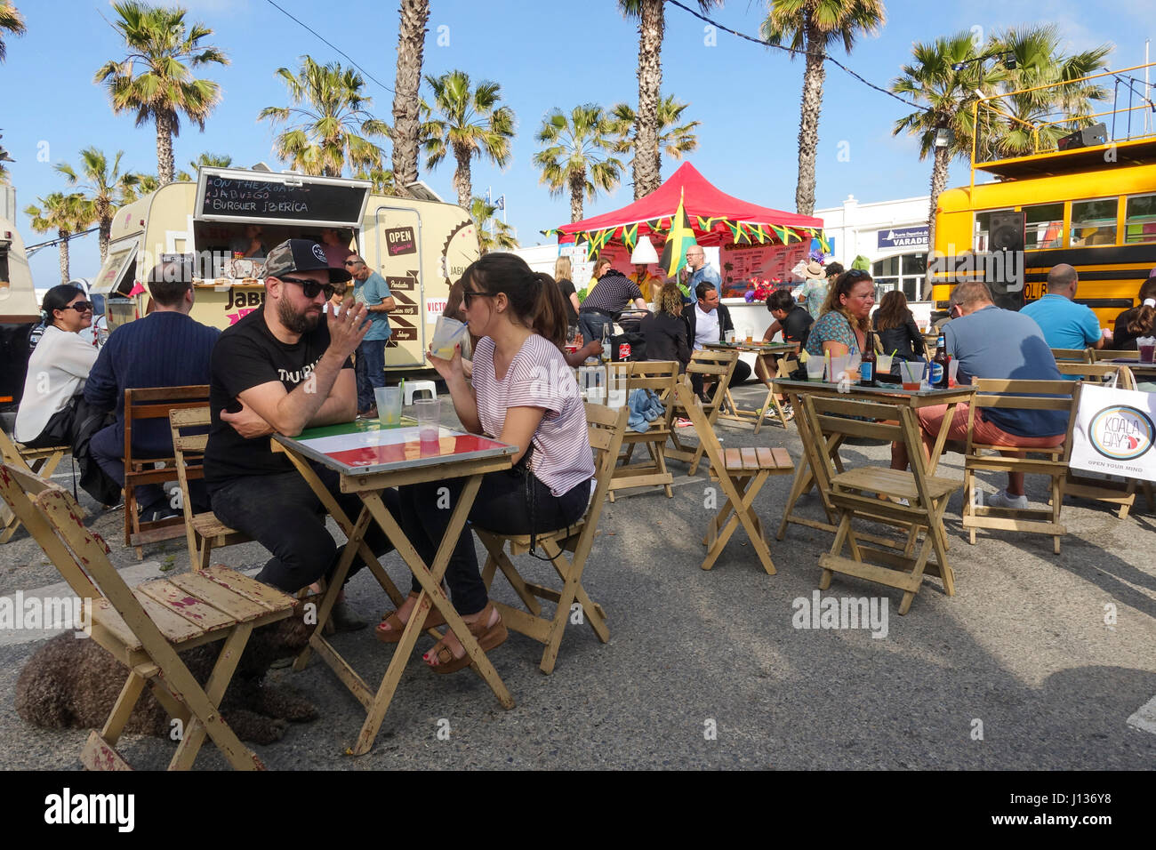 People eating at Food trucks at festival, festive, celebration in Port of Benalmadena, Andalusia, Spain Stock Photo