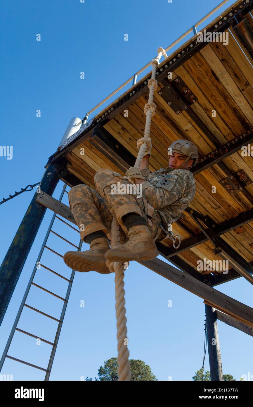 A U.S. Army Ranger performs a rope climb during the Best Ranger