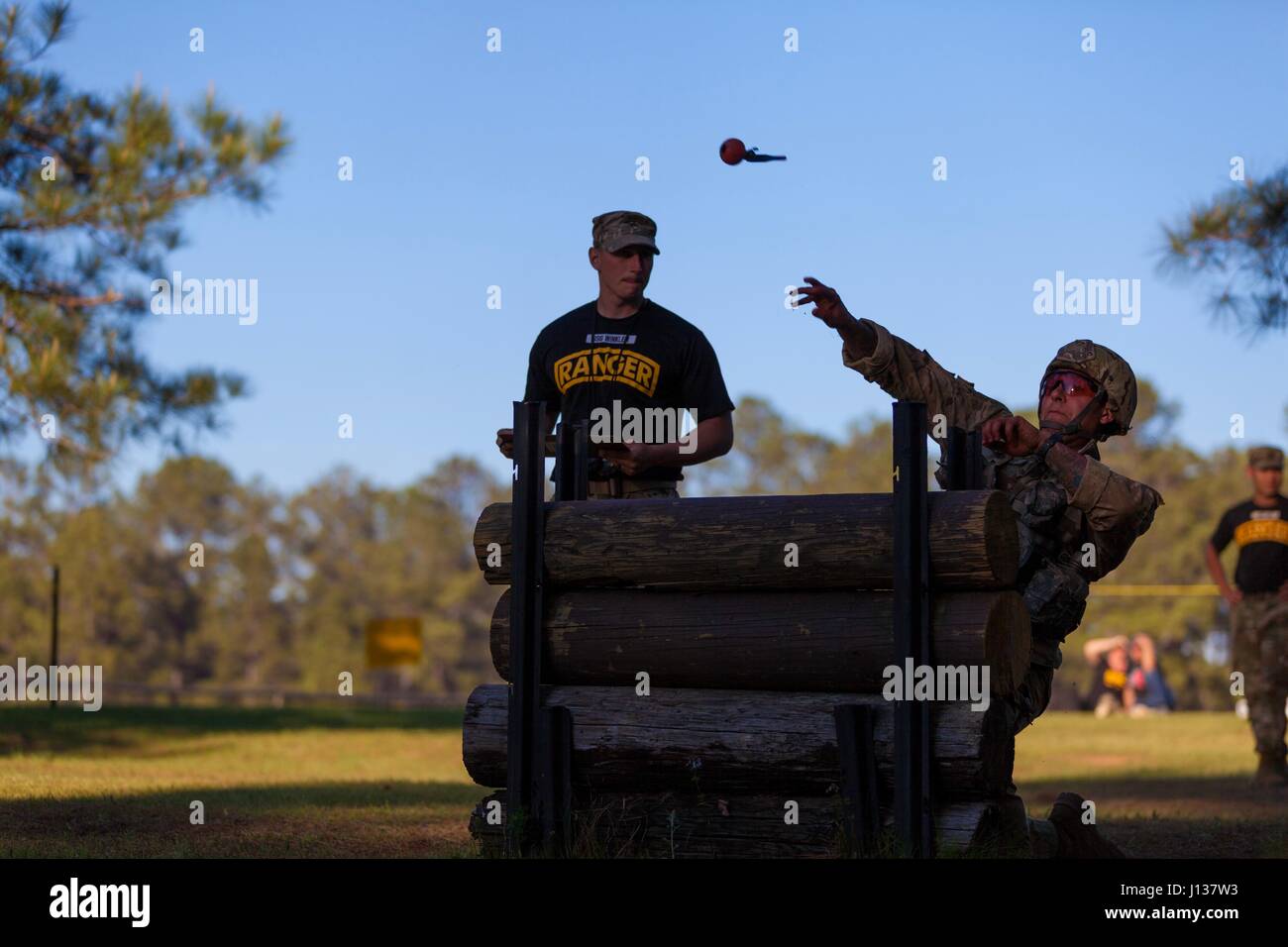A U.S. Army Ranger performs a grenade throw during the Best Ranger