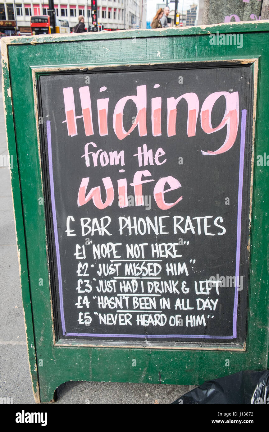 Funny shop sign Hiding From Wife humour fun sign Liverpool Merseyside 