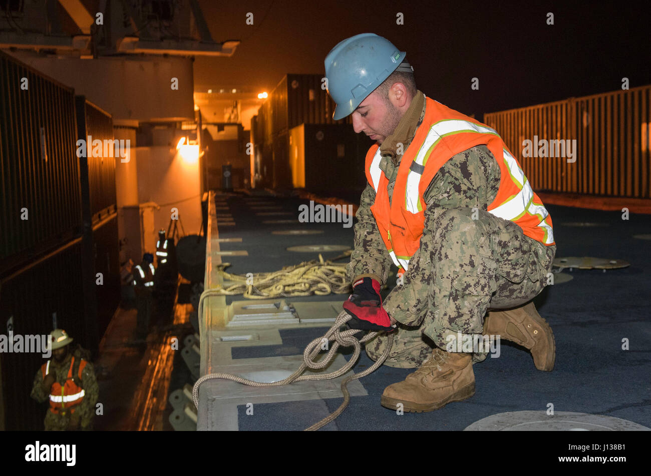 170408-N-OU129-457 POHANG, Republic of Korea (Apr. 9, 2017) Boatswain Mate Seaman Nicholas Kakoules from Navy Cargo Handling Battalion One secures lines to a beach module for unloading from Navy Maritime Prepositioning Force Ship USNS Pililaau (T-AK 304) using Improved Navy Lighterage System (INLS) while anchored off the coast of Pohang, Republic of Korea during Combined Joint Logistics Over the Shore (CJLOTS) April 9. CJLOTS is a biennial exercise conducted by military and civilian personnel from the United States and the Republic of Korea, training to deliver and redeploy military cargo as a Stock Photo