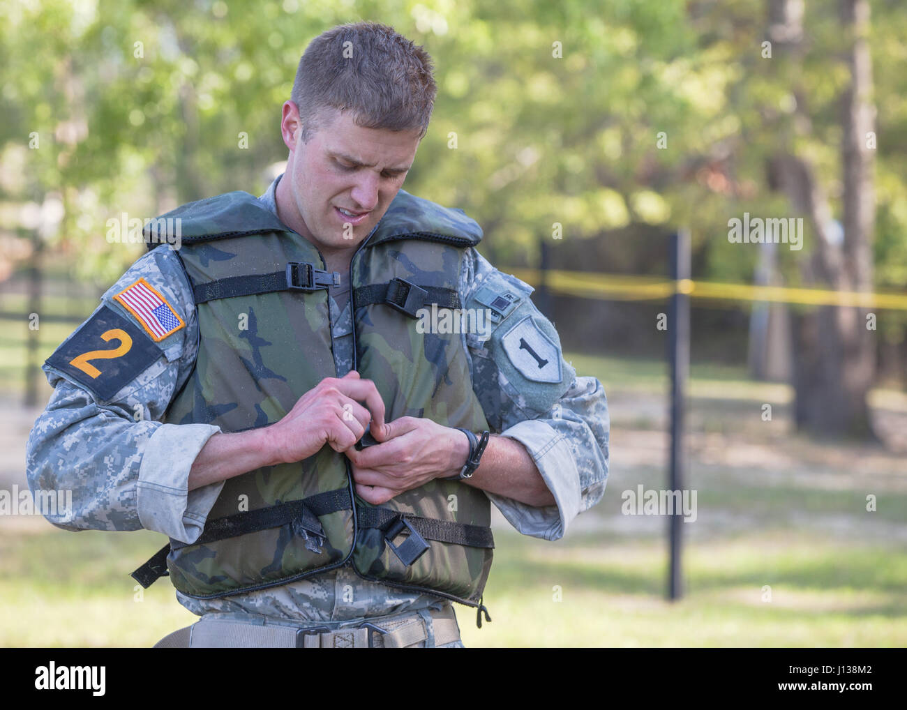 U.S. Army Ranger 1st Lt. Timothy Nelson, assigned to the 1st Infantry Division, puts on a life