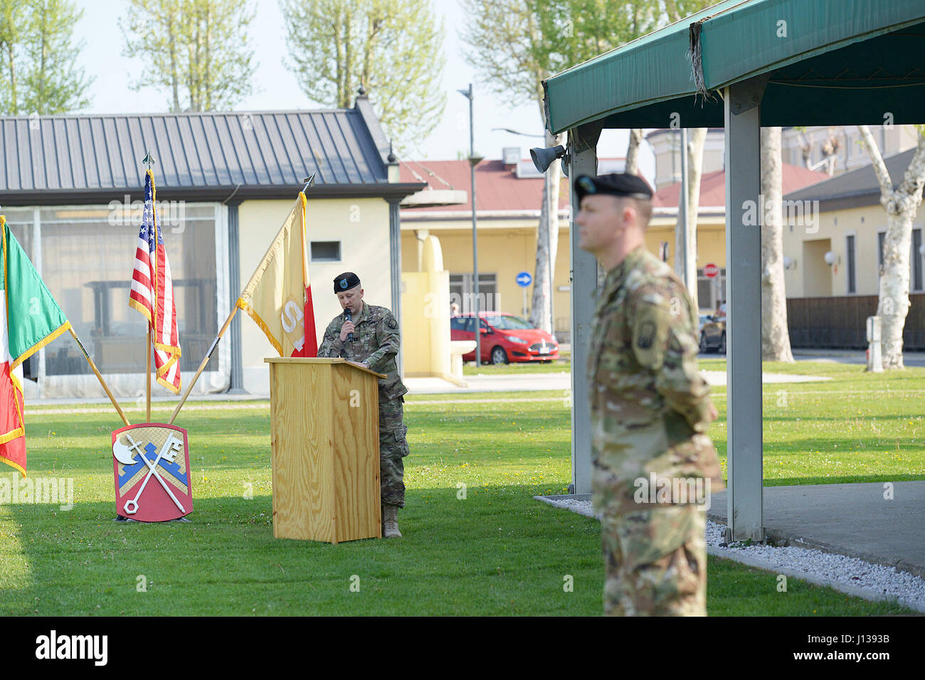 The outgoing commander delivers remarks during a change of command ...