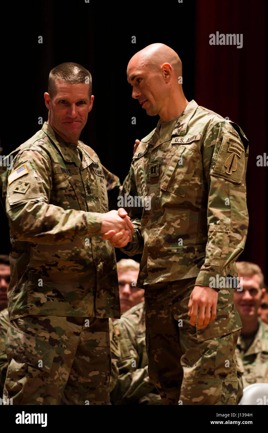 Sargent Major of the Army Daniel Dailey congratulates Capt. Robert Killian of the National Guard for completing the Best Ranger Competition 2017 at Fort Benning, Ga., April 10, 2017. The 34th annual David E. Grange Jr. Best Ranger Competition 2017 is a three-day event consisting of challenges to test competitor's physical, mental, and technical capabilities. (U.S Army Photo by Spc. Kristen Dobson) Stock Photo