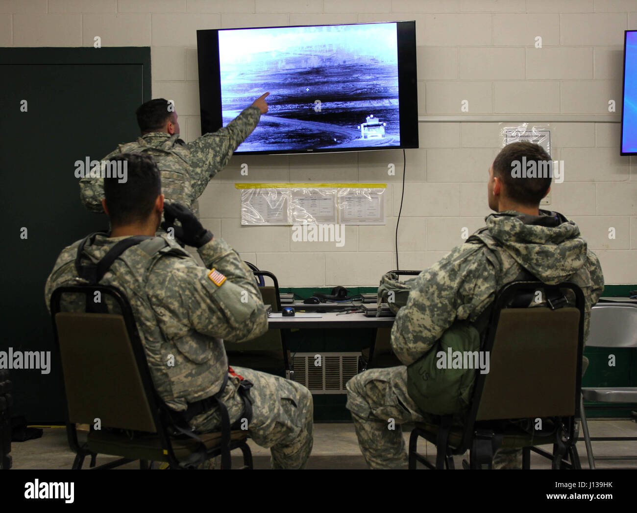 U.S. Army Reserve Soldiers with 325th Psychological Operations Company (Airborne), U.S. Army Civil Affairs and Psychological Operation Command, identify targets on a thermal image during Operation Cold Steel at Fort McCoy, Wis., April 11, 2017. Operation Cold Steel is the U.S. Army Reserve's crew-served weapons qualification and validation exercise to ensure that America's Army Reserve units and Soldiers are trained and ready to deploy on short-notice and bring combat-ready and lethal firepower in support of the Army and our joint partners anywhere in the world. (U.S. Army Reserve photo by Sta Stock Photo