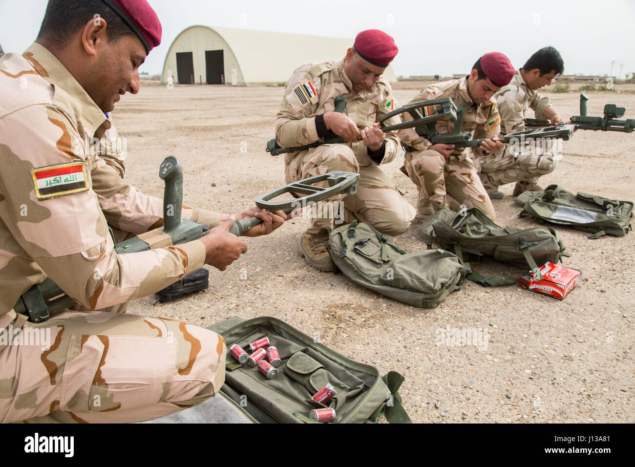 Iraqi security forces soldiers assemble mine detectors during counter improvised explosive device training provided by British army trainers deployed in support of Combined Joint Task Force – Operation Inherent Resolve at Camp Taji, Iraq, April 12, 2017. This training is part of the overall Combined Joint Task Force – Operation Inherent Resolve building partner capacity mission by training and improving the capability of partnered forces fighting ISIS. CJTF-OIR is the global Coalition to defeat ISIS in Iraq and Syria.  (U.S. Army photo by Spc. Christopher Brecht) Stock Photo