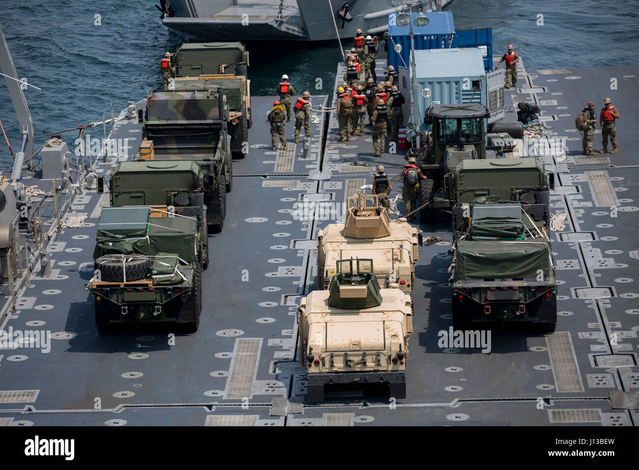 U.S. Marines, Sailors, and Coast Guardsmen aboard the USNS Pililaau conduct loading and off loading of cargo and gear during Combined Joint Logistics Over The Shore (CJ LOTS) Exercise in the Republic of Korea (ROK) in the Sea of Japan, Pohang, Korea, April 13, 2017. CJ LOTS is an exercise designed to train U.S. and ROK service members to accomplish vital logistical measures in a strategic area while strengthening communication and cooperation between the U.S. and ROK alliance. (U.S. Marine Corps photo by MCIPAC Combat Camera Lance Cpl. Antonia E. Mercado) Stock Photo