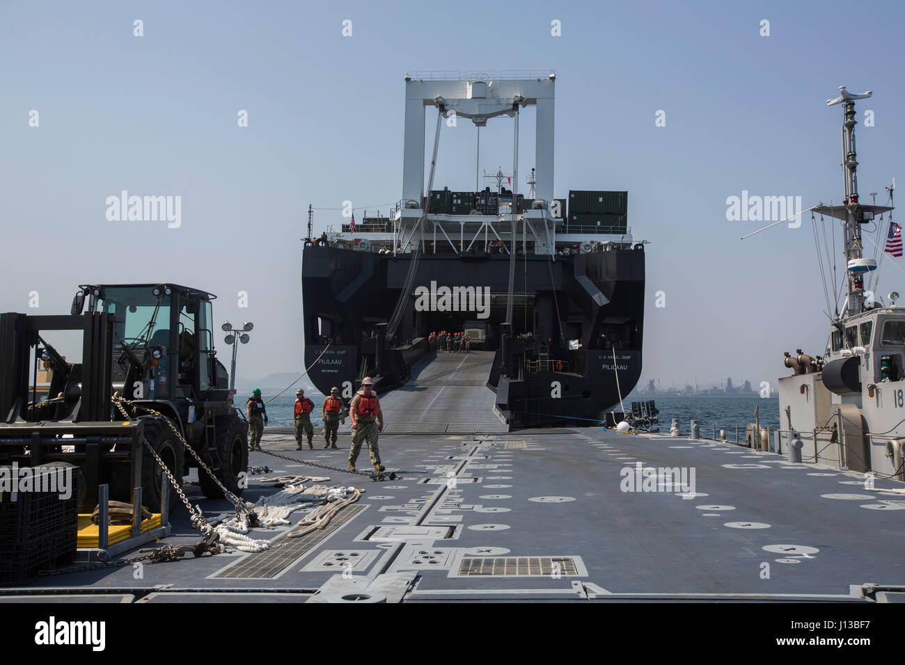 U.S. Marines, Sailors, and Coast Guardsmen aboard the USNS Pililaau conduct loading and off loading of cargo and gear during Combined Joint Logistics Over The Shore (CJ LOTS) Exercise in the Republic of Korea (ROK) in the Sea of Japan, Pohang, Korea, April 13, 2017. CJ LOTS is an exercise designed to train U.S. and ROK service members to accomplish vital logistical measures in a strategic area while strengthening communication and cooperation between the U.S. and ROK alliance. (U.S. Marine Corps photo by MCIPAC Combat Camera Lance Cpl. Antonia E. Mercado) Stock Photo