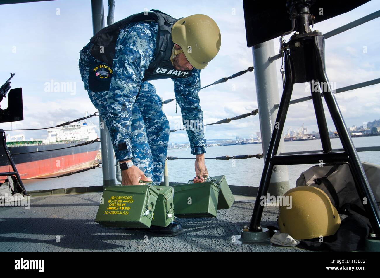 PORTLAND, Ore. (April 6, 2017) - Boatswain's Mate 3rd Class Brandon Elliott, a native of Sanford, N.C. and assigned to the submarine tender USS Frank Cable (AS 40), secures the weapons watch from sea and anchor, after transiting the Columbia River to Portland, Ore., April 6. Frank Cable is in Portland, Ore. for a scheduled dry-dock phase maintenance availability.  (U.S. Navy photo by Mass Communication Specialist 3rd Class Alana Langdon/Released) Stock Photo