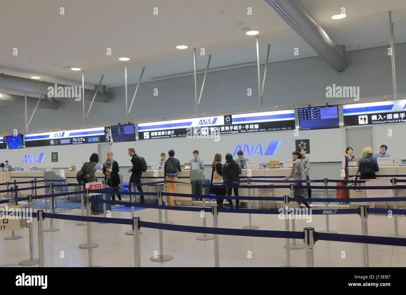 People check in at ANA All Nippon Air check in counter Kansai international airport. Stock Photo