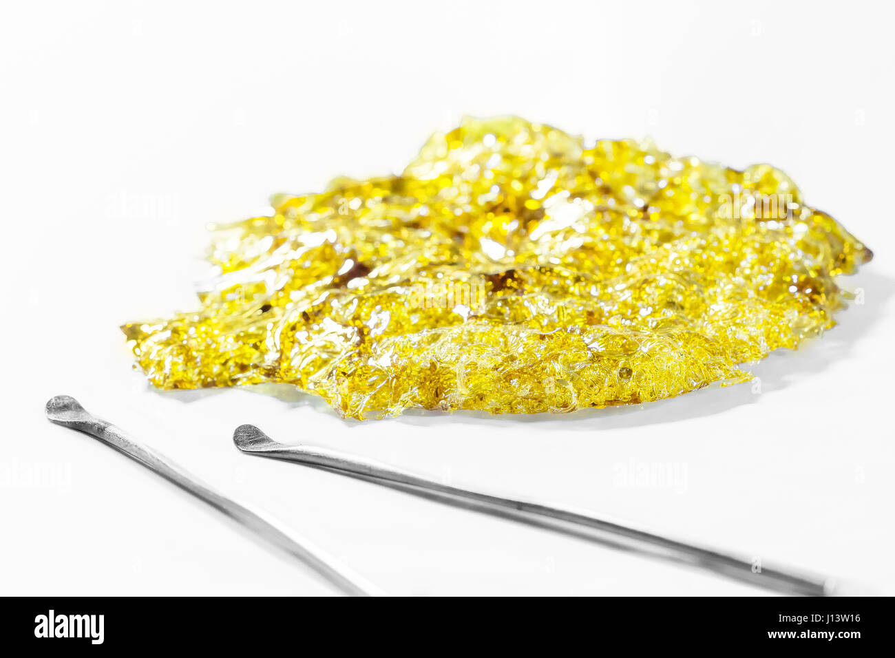 A nice shatter patty! Plus a few dab tools to sweeten the deal. Butane hash oil at its finest. Stock Photo