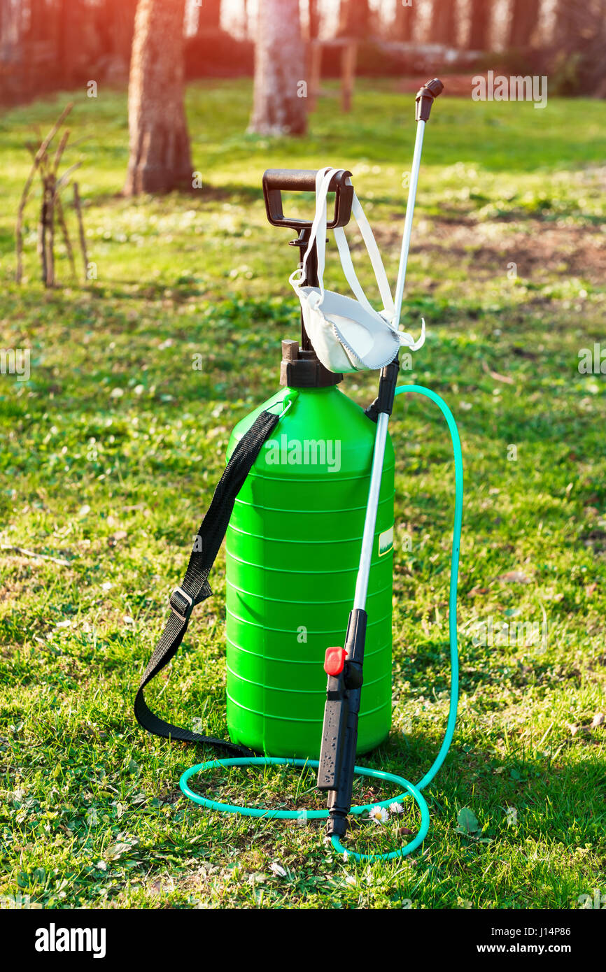 green sprayer on spring garden Stock Photo - Alamy