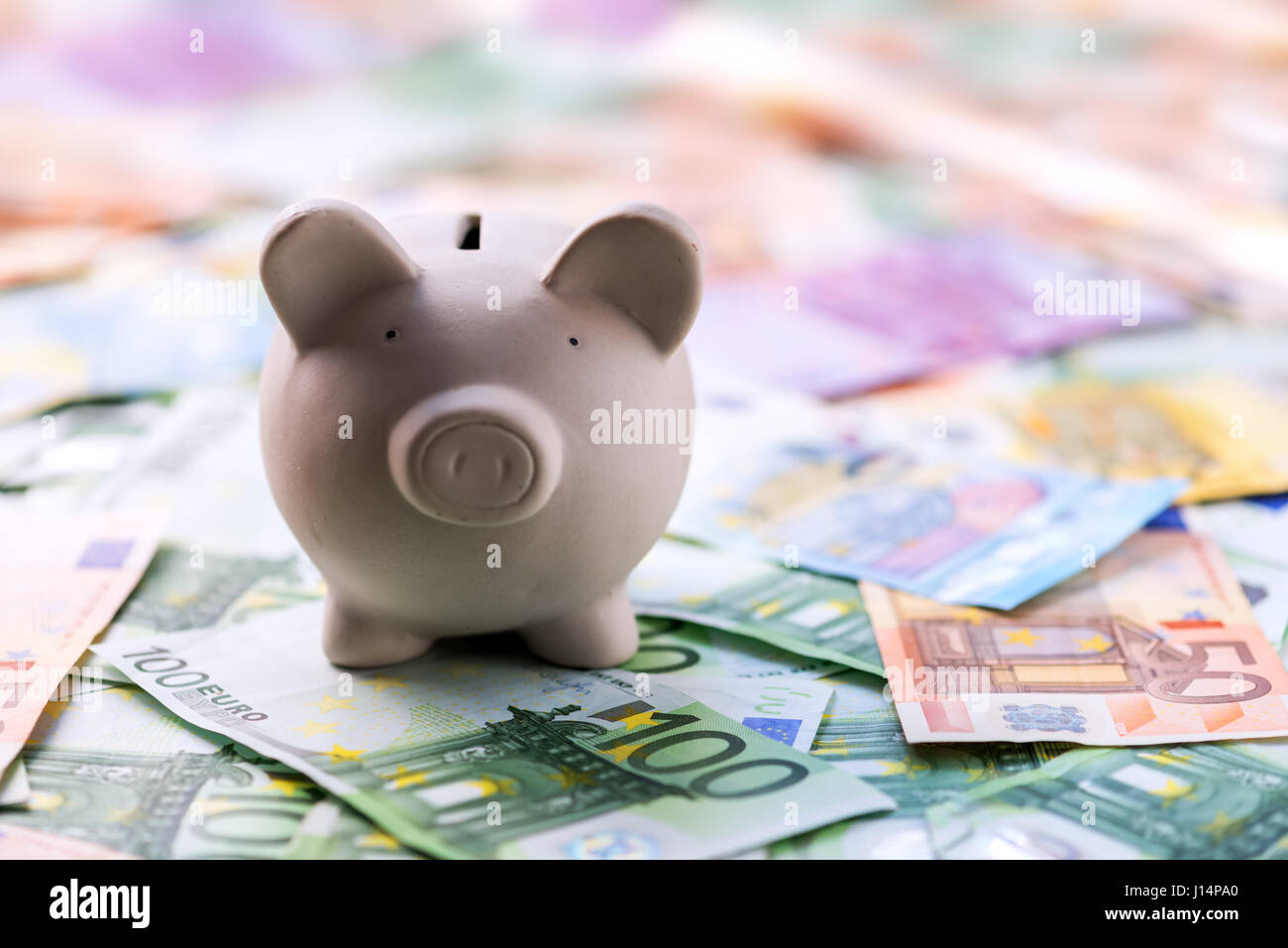 pig money box with cash closeup Stock Photo